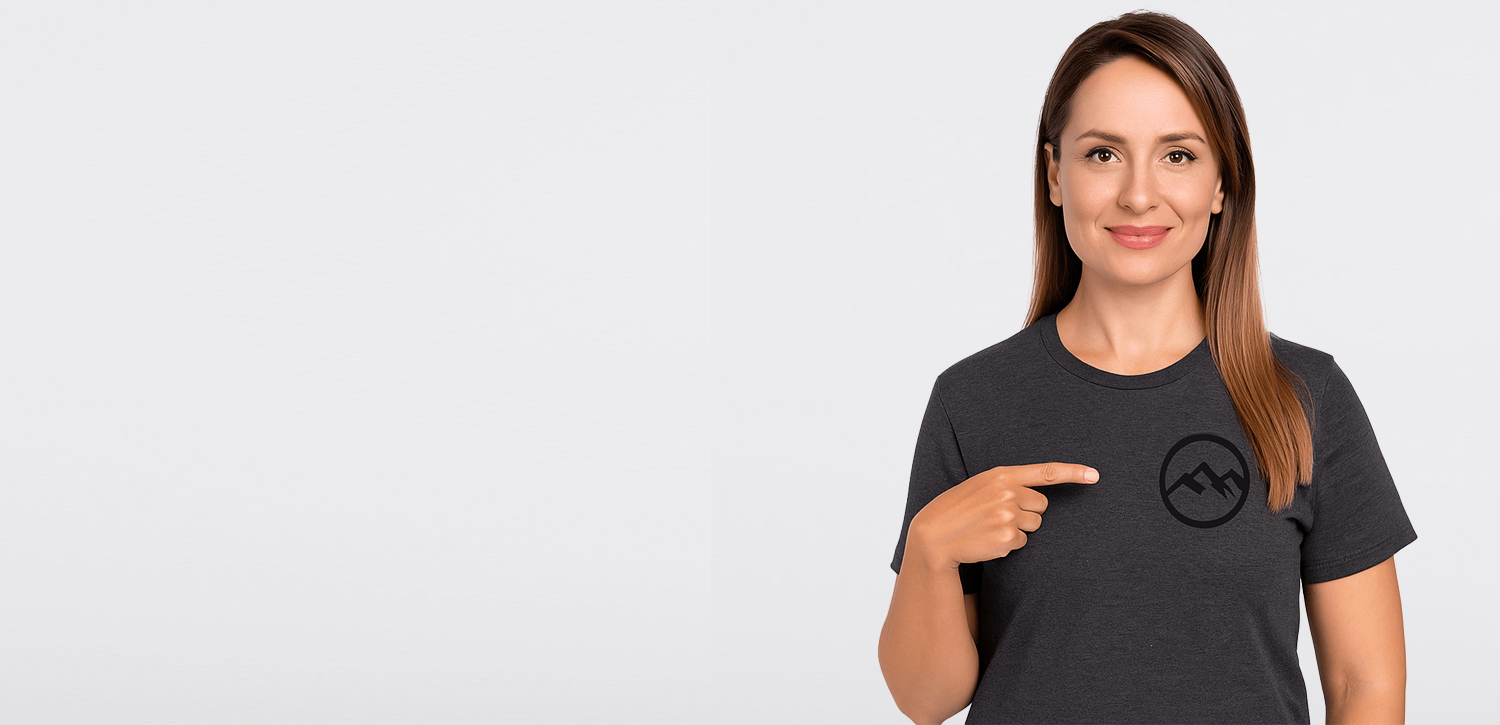 woman pointing to her shirt
