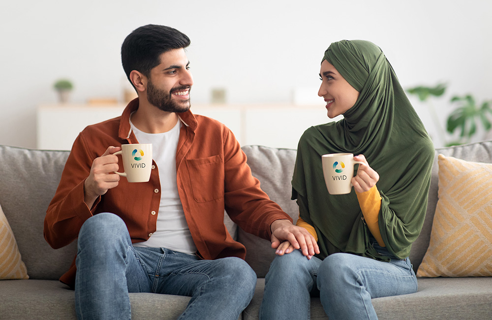 two people drinking from mugs