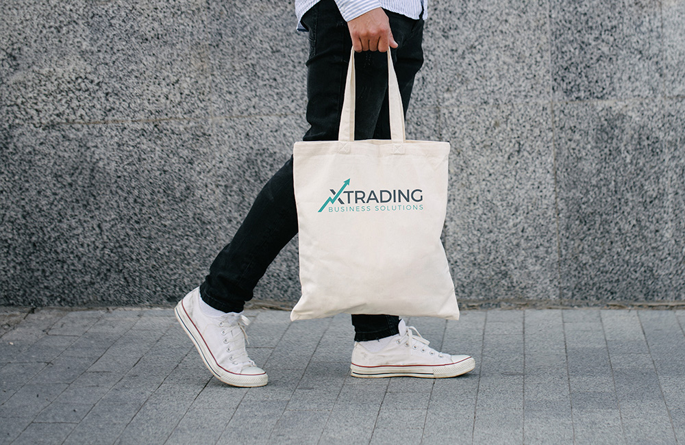 carrying a white tote bag