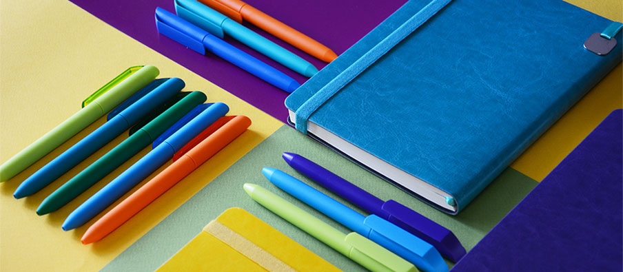 colorful pens and notebooks