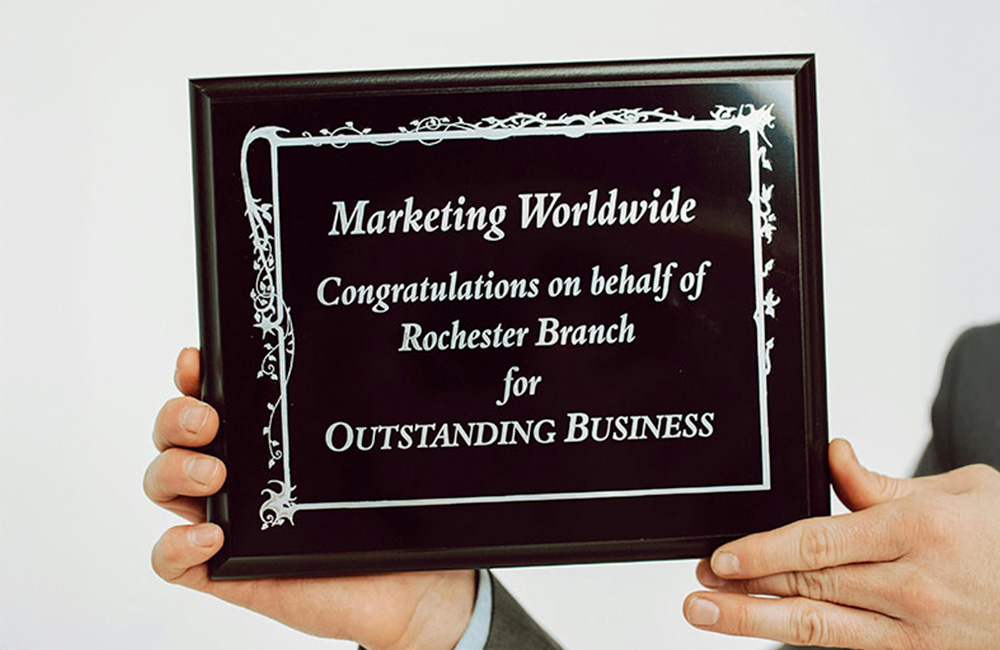 woman drinking from a reusable water bottle